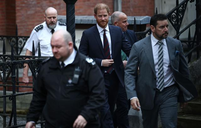 (FILES) Britain's Prince Harry, Duke of Sussex (C), leaves the Royal Courts of Justice, Britain's High Court, in London on January 22, 2026, on the fourth day of the trial in his case against a major UK newspaper group. Prince Harry and others are ordered to pay Daily Mail £9.5-mln in initial costs, August 21. (Photo by Henry NICHOLLS / AFP)