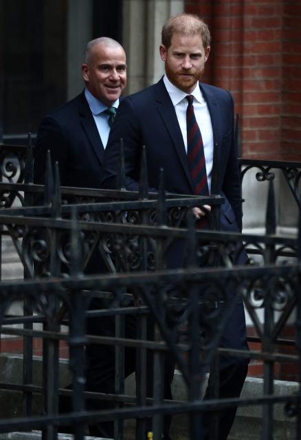 (FILES) Britain's Prince Harry, Duke of Sussex, leave the Royal Courts of Justice, Britain's High Court, in London on January 22, 2026, on the fourth day of the trial in his case against a major UK newspaper group. Prince Harry and others are ordered to pay Daily Mail £9.5-mln in initial costs, August 21. (Photo by Henry NICHOLLS / AFP)