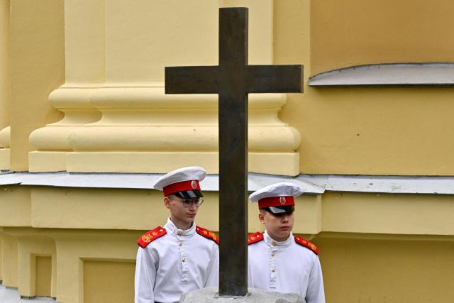 Cadets of the First Cadet Corps attend a ceremony dedicated to Russian Officer's Day in the Peter and Paul Cathedral in St. Petersburg on August 21, 2026. (Photo by Olga MALTSEVA / AFP)