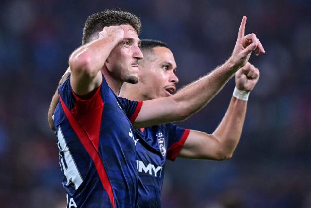 Johor Darul Ta'zim's Oscar Arribas Pasero (L) celebrates after scoring a goal during the opening football match of the Malaysia Super League between Johor Darul Ta'zim and Kuching City at the Sultan Ibrahim Stadium in Iskandar Puteri, in Malaysia's Johor state on August 21, 2026. (Photo by Mohd RASFAN / AFP)