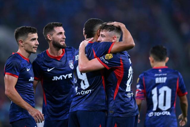 Johor Darul Ta'zim's Oscar Arribas Pasero (2R) celebrates with teammates after scoring a goal during the opening football match of the Malaysia Super League between Johor Darul Ta'zim and Kuching City at the Sultan Ibrahim Stadium in Iskandar Puteri, in Malaysia's Johor state on August 21, 2026. (Photo by Mohd RASFAN / AFP)