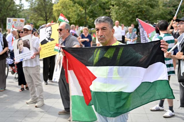 Members and supporters of the Palestinian community take part in a pro-Palestinian demonstration on August 21, 2026 in Budapest, in solidarity with Palestinians detained by Israel and with Palestinian physician and director of Gaza's Kamal Adwan hospital Hussam Abu Safiya detained by Israeli forces. Several Jewish organizations criticized both the event and the authorities' decision to allow it, while police stated that they had found no legal grounds to prohibit the gathering. The controversy stems from allegations by Israeli and Jewish organizations that Abu Safiya has links to Hamas and was a member of the organization, while his supporters regard him as a political detainee and reject those accusations. (Photo by Attila KISBENEDEK / AFP)