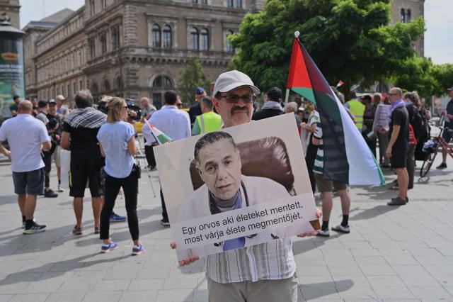 Members and supporters of the Palestinian community take part in a pro-Palestinian demonstration on August 21, 2026 in Budapest, in solidarity with Palestinian physician and director of Gaza's Kamal Adwan hospital Hussam Abu Safiya detained by Israeli forces. Several Jewish organizations criticized both the event and the authorities' decision to allow it, while police stated that they had found no legal grounds to prohibit the gathering. The controversy stems from allegations by Israeli and Jewish organizations that Abu Safiya has links to Hamas and was a member of the organization, while his supporters regard him as a political detainee and reject those accusations. (Photo by Attila KISBENEDEK / AFP)