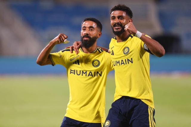 Nassr's Saudi defender #05 Abdulelah Al-Amri (R) celebrates with his teammate Nassr's Saudi defender #12 Nawaf Boushal after scoring his team's first goal during the Saudi Pro League football match between Al-Nassr and Al-Riyadh at the Prince Turki bin Abdul Aziz Stadium in Riyadh on August 21, 2026. (Photo by Fayez NURELDINE / AFP)