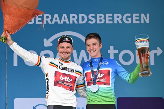 Lotto-Intermarche's Belgian rider Jenno Berckmoes (R) celebrates with Lotto-Intermarche's Belgian rider Lionel Taminiaux (L), after winning the stage 3 of the "Renewi Tour" multi-stage cycling race, 182 km from Celles to Geraardsbergen on August 21, 2026. (Photo by DAVID PINTENS / Belga / AFP) / Belgium OUT
