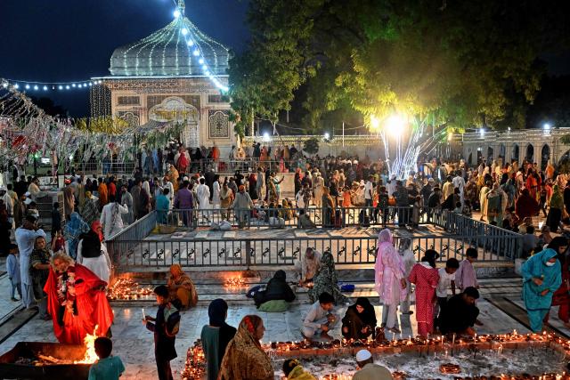 Devotees gather to mark the 'Urs' or death anniversary of the Sufi saint Mian Mir at his shrine in Lahore on August 21, 2026. (Photo by Arif ALI / AFP)