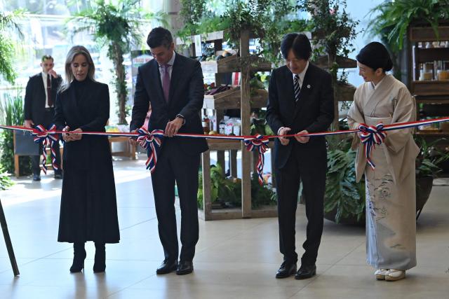 Japan's Crown Prince Akishino (2-R), Princess Kiko, Paraguay's President Santiago Pena (2-L) and his wife Leticia Ocampos, take part in the ribbon-cutting ceremony during the commemoration of the 90th anniversary of the Japanese immigration in Paraguay, at the Conmebol headquarters in Luque, Paraguay, on August 21, 2026. (Photo by DANIEL DUARTE / AFP)