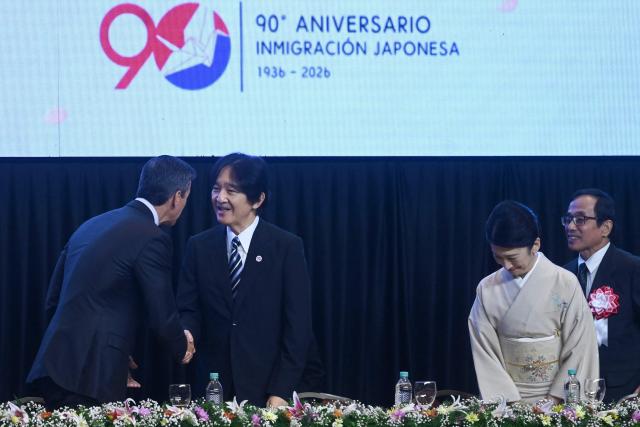Japan's Crown Prince Akishino (2-L) shakes hands with Paraguay's President Santiago Pena (L) as Princess Kiko (2-R) bows during the commemoration of the 90th anniversary of the Japanese immigration in Paraguay, at the Conmebol headquarters in Luque, Paraguay, on August 21, 2026. (Photo by DANIEL DUARTE / AFP)
