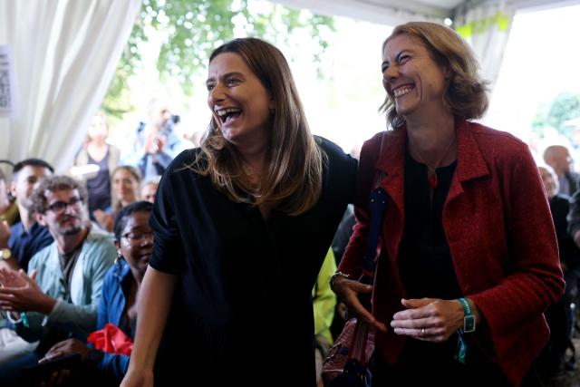 National secretary of French left-wing The Ecologistes party Marine Tondelier (L) and Grenoble's mayor Laurence Ruffin arrive to deliver a speech during The Ecologistes party's "universitй d'йtй" annual summer meeting in Saint-Martin-d’Heres, eastern France, on August 21, 2026. (Photo by Alex MARTIN / AFP)