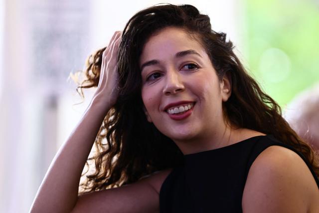 Rania Kissi, co-founder of the Committee for the Protection of Children in Care (Comitй de vigilance des enfants placйs) looks on during The Ecologistes party's "universitй d'йtй" annual summer meeting in Saint-Martin-d’Heres, eastern France, on August 21, 2026. (Photo by Alex MARTIN / AFP)
