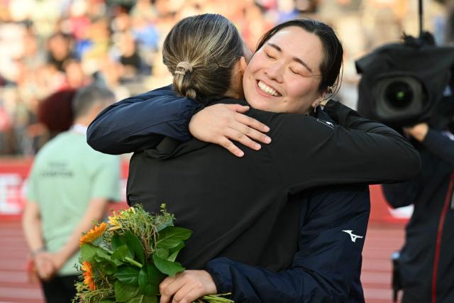 Japan's Haruka Kitaguchi is congratulated after winning the women's Javelin Throw during the World Athletics Diamond League athletics meeting at the Stade Olympique de la Pontaise in Lausanne, on August 21, 2026. (Photo by Fabrice COFFRINI / AFP)