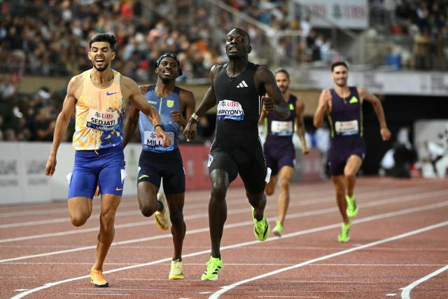 Kenya's Emmanuel Wanyonyi (C) crosses the line to win the men's 800m final ahead of Algeria's Djamel Sedjati (L) during the World Athletics Diamond League athletics meeting at the Stade Olympique de la Pontaise in Lausanne, on August 21, 2026. (Photo by Fabrice COFFRINI / AFP)
