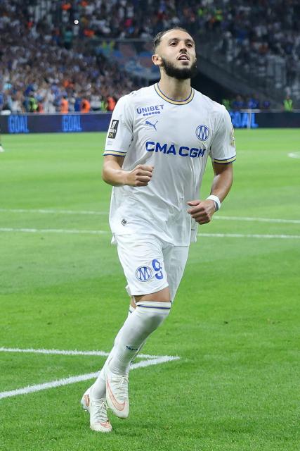 Marseille's Algerian forward #09 Amine Gouiri celebrates after scoring his team's second goal from the penalty spot during the French L1 football match between Olympique de Marseille (OM) and RC Strasbourg Alsace at the Stade Velodrome in Marseille, south-eastern France on August 21, 2026. (Photo by Pascal POCHARD-CASABIANCA / AFP)