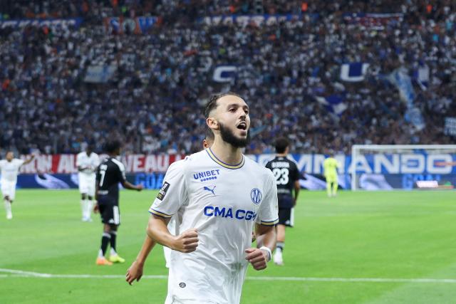 Marseille's Algerian forward #09 Amine Gouiri celebrates after scoring his team's second goal from the penalty spot during the French L1 football match between Olympique de Marseille (OM) and RC Strasbourg Alsace at the Stade Velodrome in Marseille, south-eastern France on August 21, 2026. (Photo by Pascal POCHARD-CASABIANCA / AFP)