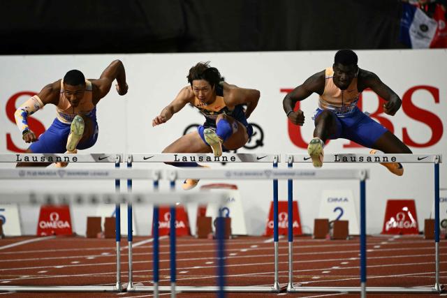 Japan's Shunsuke Izumiya (C) competes in the men's 110m Hurdles final during the World Athletics Diamond League athletics meeting at the Stade Olympique de la Pontaise in Lausanne, on August 21, 2026. (Photo by Fabrice COFFRINI / AFP)