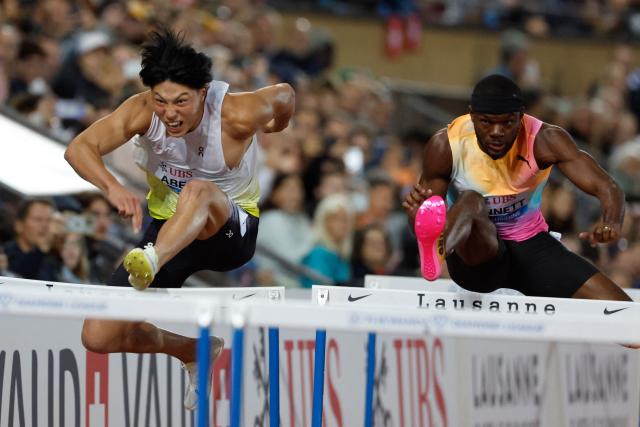 Japan's Tatsuki Abe (L) and Jamaica's Orlando Bennett (R) compete in the men's 110m Hurdles final during the World Athletics Diamond League athletics meeting at the Stade Olympique de la Pontaise in Lausanne, on August 21, 2026. (Photo by Stefan Wermuth / AFP)