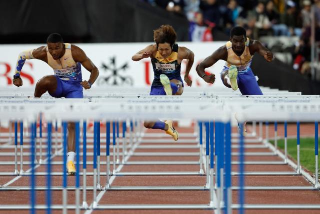 Japan's Shunsuke Izumiya (C) competes in the men's 110m Hurdles final during the World Athletics Diamond League athletics meeting at the Stade Olympique de la Pontaise in Lausanne, on August 21, 2026. (Photo by Stefan Wermuth / AFP)