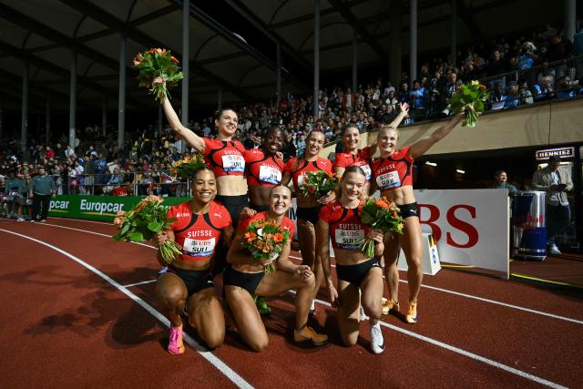 Switzerland's women's 100m relay team celebrate winning the Women's 4x100m during the World Athletics Diamond League athletics meeting at the Stade Olympique de la Pontaise in Lausanne, on August 21, 2026. (Photo by Fabrice COFFRINI / AFP)