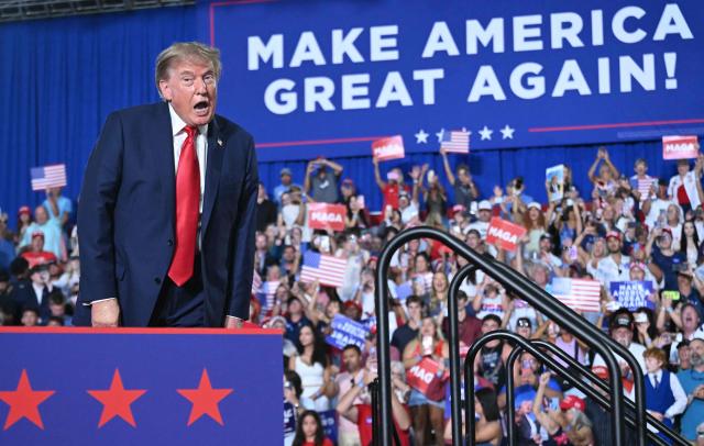 US President Donald Trump arrives to speak during a campaign rally for US Senator Darline Graham at Myrtle Beach Convention Center in Myrtle Beach, South Carolina on August 21, 2026. (Photo by SAUL LOEB / AFP)