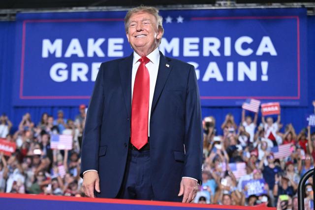 US President Donald Trump smile as he arrives to speak during a campaign rally for US Senator Darline Graham at Myrtle Beach Convention Center in Myrtle Beach, South Carolina on August 21, 2026. (Photo by SAUL LOEB / AFP)