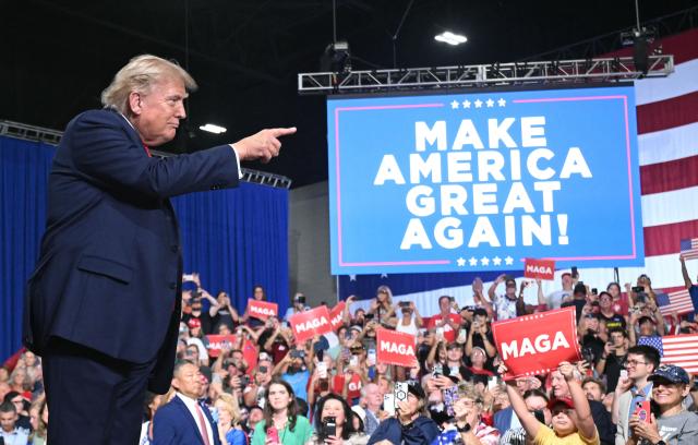 US President Donald Trump points as he arrives to speak during a campaign rally for US Senator Darline Graham at Myrtle Beach Convention Center in Myrtle Beach, South Carolina on August 21, 2026. (Photo by SAUL LOEB / AFP)