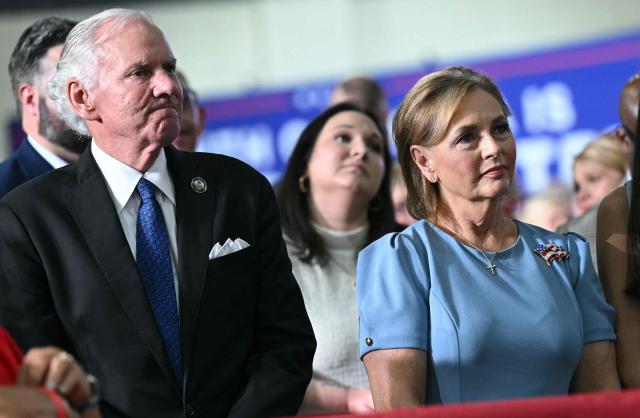 South Carolina Governor Henry McMaster (L) and US Senator Darline Graham listen to US President Donald Trump speak during a campaign rally at Myrtle Beach Convention Center in Myrtle Beach, South Carolina on August 21, 2026. (Photo by SAUL LOEB / AFP)