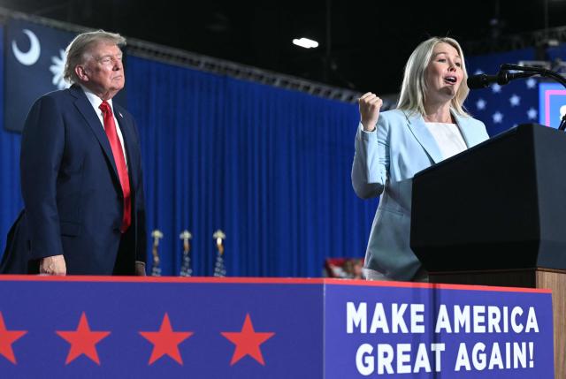US President Donald Trump listens to White House Press Secretary Karoline Leavitt speak during a campaign rally at Myrtle Beach Convention Center in Myrtle Beach, South Carolina on August 21, 2026. (Photo by SAUL LOEB / AFP)