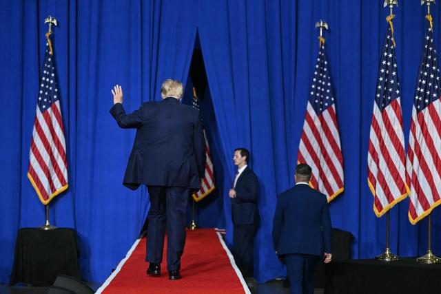 US President Donald Trump waves as he leaves after speaking at a campaign rally for US Senator Darline Graham at Myrtle Beach Convention Center in Myrtle Beach, South Carolina on August 21, 2026. (Photo by SAUL LOEB / AFP)