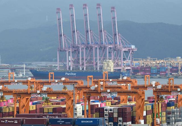 The container ship "Panstar Acro" is anchored at Busan New Port in Busan on August 22, 2026, as the vessel is scheduled to sail to Europe via the Arctic to test the commercial viability of the shipping route opened by melting ice. South Korea plans its first trial voyage through the Arctic this week as Middle East conflict disrupts global shipping, Seoul's oceans ministry said on August 20, while environmental groups warn the route could accelerate melting of polar ice. (Photo by Jung Yeon-je / AFP)