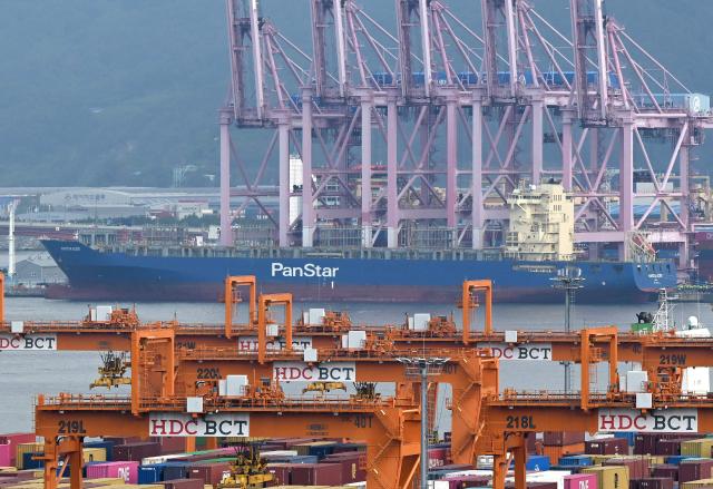 The container ship "Panstar Acro" is anchored at Busan New Port in Busan on August 22, 2026, as the vessel is scheduled to sail to Europe via the Arctic to test the commercial viability of the shipping route opened by melting ice. South Korea plans its first trial voyage through the Arctic this week as Middle East conflict disrupts global shipping, Seoul's oceans ministry said on August 20, while environmental groups warn the route could accelerate melting of polar ice. (Photo by Jung Yeon-je / AFP)