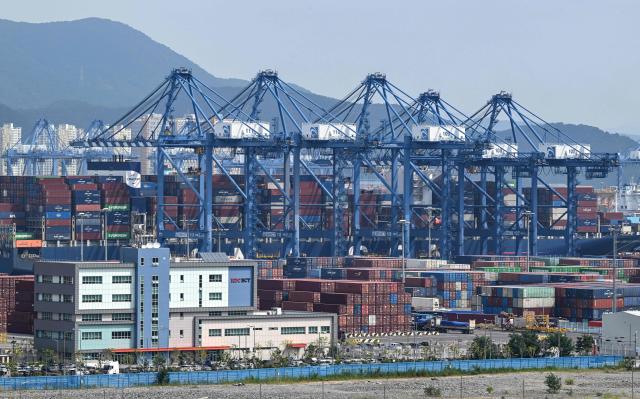 This general view shows shipping containers and cranes at Busan New Port in Busan on August 22, 2026. (Photo by Jung Yeon-je / AFP)