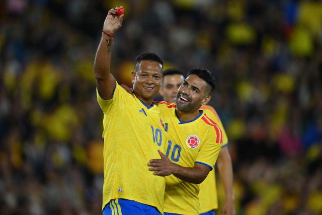 Former Colombian player Fredy Guarin and forward Radamel Falcao attend a football match to raise funds for the victims of an 7.4 earthquake, at El Campin stadium in Bogota on August 21, 2026. The powerful earthquake that killed hundreds of people in western Colombia caused $9.57 billion in economic losses, President Abelardo de la Espriella said on August 18, issuing a preliminary estimate. (Photo by Raul ARBOLEDA / AFP)