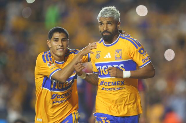 Tigres’ Uruguayan forward #17 Rodrigo Aguirre (R) celebrates after scoring the opening goal with teammate midfielder #198 Isac Galvan during the Liga MX Apertura football match between Tigres and Atlante at the Universitario stadium in San Nicolas de los Garza, Nuevo Leon, Mexico on August 21, 2026. (Photo by Julio Cesar AGUILAR / AFP)