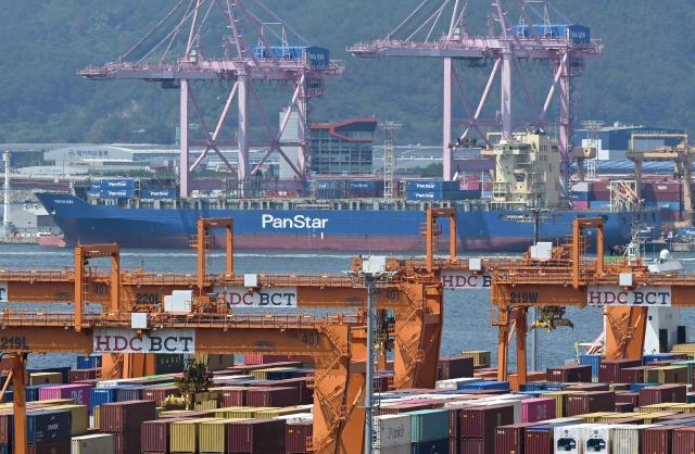 The container ship "Panstar Acro" is anchored to load containers at Busan New Port in Busan on August 22, 2026, as the vessel is scheduled to sail to Europe via the Arctic to test the commercial viability of the shipping route opened by melting ice. South Korea was set on August 22, to send its first trial container through the Arctic, as the Middle East war rattles global shipping, while environmental groups warned the route could accelerate polar ice melt. (Photo by Jung Yeon-je / AFP)