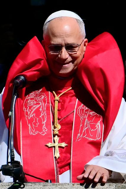 Pope Leo XIV greets the crowd from the balcony of the Public Palace during a pastoral visit to San Marino on August 22, 2026. (Photo by Stefano RELLANDINI / AFP)