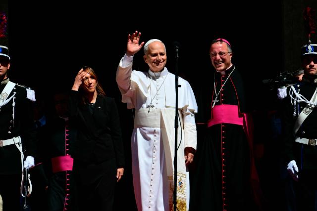 Pope Leo XIV greets the crowd outside San Marino's basilica during a pastoral visit on August 22, 2026. (Photo by Stefano RELLANDINI / AFP)