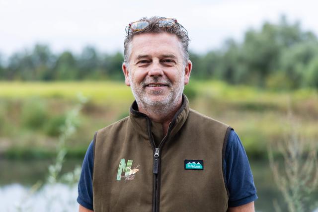 Vice-president of the Nord departmental federation of hunters (FDC59) and president of its Waterfowl Commission Guillaume Puppinck poses for a photograph in Saint-Aybert, northern France on August 21, 2026. "A passionate activity" and legal for some, "slaughter" for others: in the Harchies marshes, a Belgian protected natural area, bird conservation organisations are denouncing the opening of the hunting season, authorised for decades just a few kilometres away, on the French side. "Birds have no borders," proclaim several placards carried by a procession of around 700 people that set off at dusk on August 21, 2026 in Bernissart, Belgium, at the call of nine organizations. (Photo by Sameer Al-DOUMY / AFP)