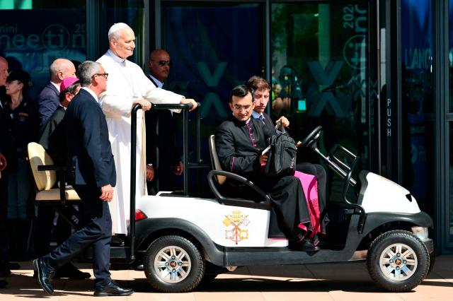 Pope Leo XIV arrives for a visit at the Children's village of the Meeting for Friendship among Peoples, the traditional gathering organised by Communion and Liberation, during a pastoral visit in Rimini on August 22, 2026. (Photo by Stefano RELLANDINI / AFP)