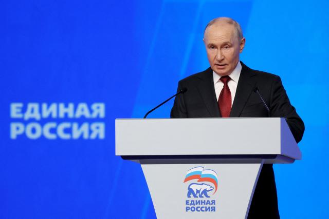 In this pool photograph distributed by the Russian state agency Sputnik, Russian President Vladimir Putin speaks at the second stage of the 23rd Congress of the United Russia party at the Megasport Arena in Moscow on August 22, 2026. (Photo by Yekaterina SHTUKINA / POOL / AFP)