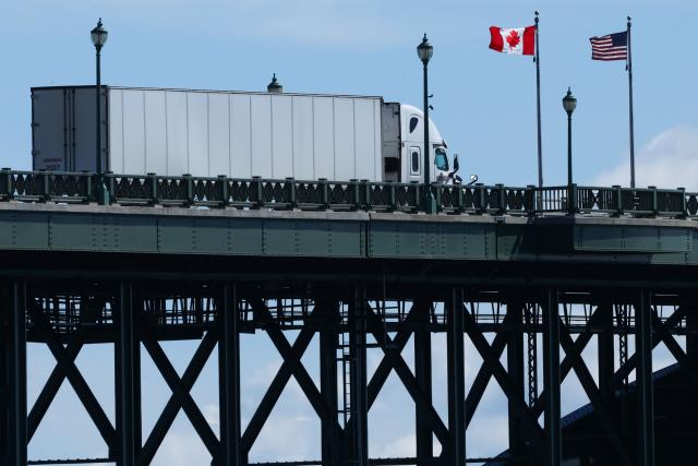 (FILES) A truck passes over the Peace Bridge from Buffalo, New York, into Canada, in Fort Erie, Ontario, on August 18, 2026. Hefty US tariffs on some Canadian products took effect on August 22, 2026 after days of negotiations that went down to the wire failed to produce an agreement. Canadian Prime Minister Mark Carney vowed that his country will match the US tariffs "dollar for dollar to protect our workers and businesses," as officials said late Friday that Washington and Ottawa had not managed to strike a deal. (Photo by Cole BURSTON / AFP)