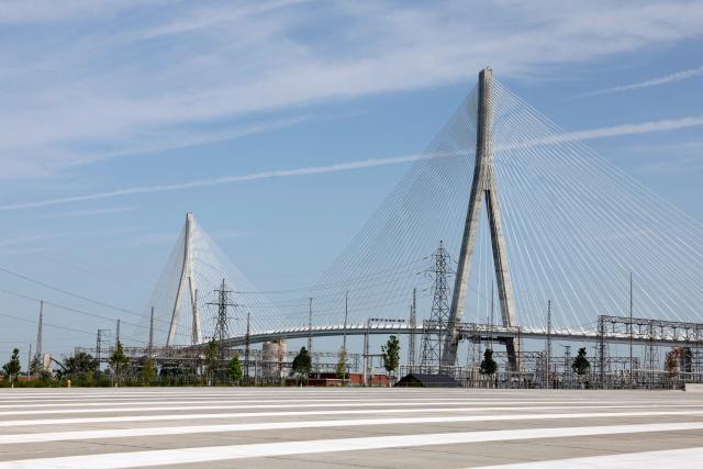 (FILES) View of the Gordie Howe International Bridge during the opening ceremony in Windsor, Ontario, on July 24, 2026. Hefty US tariffs on some Canadian products took effect on August 22, 2026 after days of negotiations that went down to the wire failed to produce an agreement. Canadian Prime Minister Mark Carney vowed that his country will match the US tariffs "dollar for dollar to protect our workers and businesses," as officials said late Friday that Washington and Ottawa had not managed to strike a deal. (Photo by JEFF KOWALSKY / AFP)