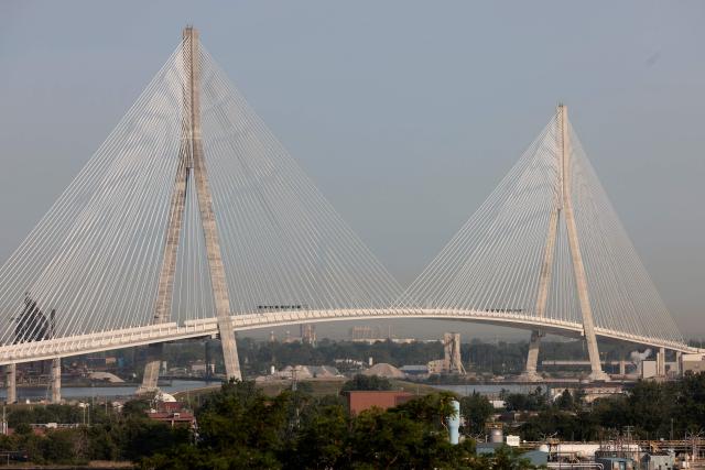 (FILES) View of the Gordie Howe International Bridge during the opening ceremony in Windsor, Ontario, on July 24, 2026. Hefty US tariffs on some Canadian products took effect on August 22, 2026 after days of negotiations that went down to the wire failed to produce an agreement. Canadian Prime Minister Mark Carney vowed that his country will match the US tariffs "dollar for dollar to protect our workers and businesses," as officials said late Friday that Washington and Ottawa had not managed to strike a deal. (Photo by JEFF KOWALSKY / AFP)
