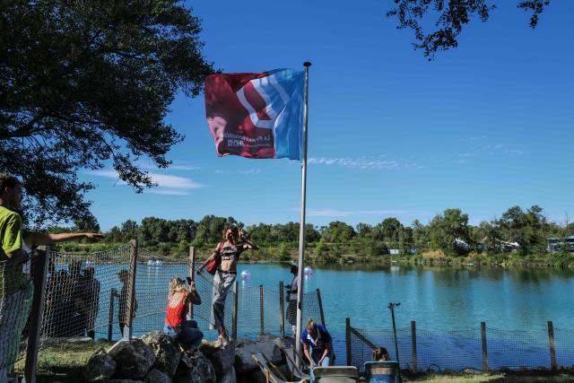 People take part in the 'Amfis' party Summer Conferences 'Universites d'ete' (Summer Seminars) of the French left wing party La France Insoumise (LFI) in Chateauneuf-sur-Isere, southeastern France, on August 22, 2026. (Photo by OLIVIER CHASSIGNOLE / AFP)
