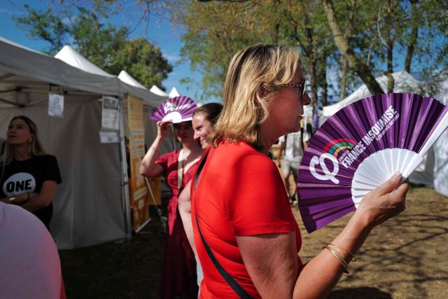 People take part in the 'Amfis' party Summer Conferences 'Universites d'ete' (Summer Seminars) of the French left wing party La France Insoumise (LFI) in Chateauneuf-sur-Isere, southeastern France, on August 22, 2026. (Photo by OLIVIER CHASSIGNOLE / AFP)