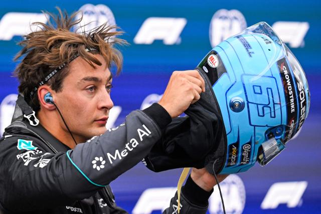P52 Mercedes' British driver George Russell takes off his helmet after the qualifying race of the Formula One Dutch Grand Prix at The Circuit Zandvoort, western Netherlands, on August 22, 2026. (Photo by JOHN THYS / AFP)