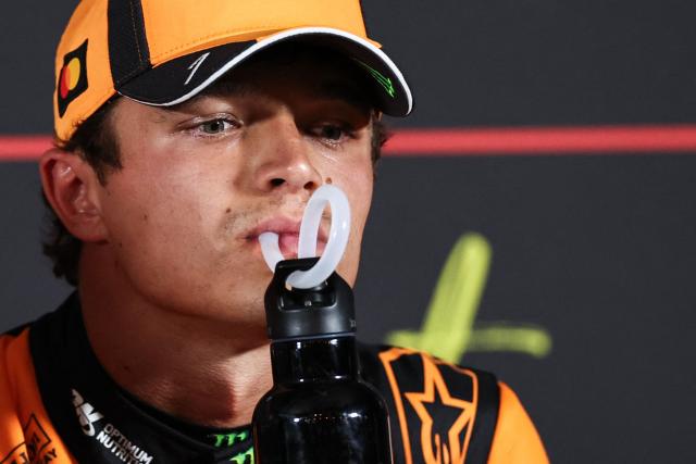 P1 McLaren's British driver Lando Norris drinks during a press conference following the qualifying race of the Formula One Dutch Grand Prix at The Circuit Zandvoort, western Netherlands, on August 22, 2026. (Photo by SIMON WOHLFAHRT / AFP)