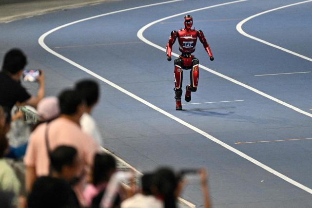 A humanoid robot competes on the first day of the 2nd World Humanoid Robot Games in Beijing on August 22, 2026. (Photo by Pedro PARDO / AFP)