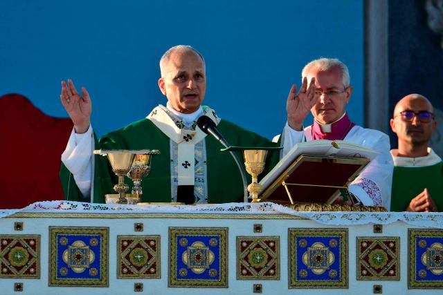 Pope Leo XIV leads a mass in the port of Rimini during a pastoral visit on August 22, 2026. (Photo by Stefano RELLANDINI / AFP)