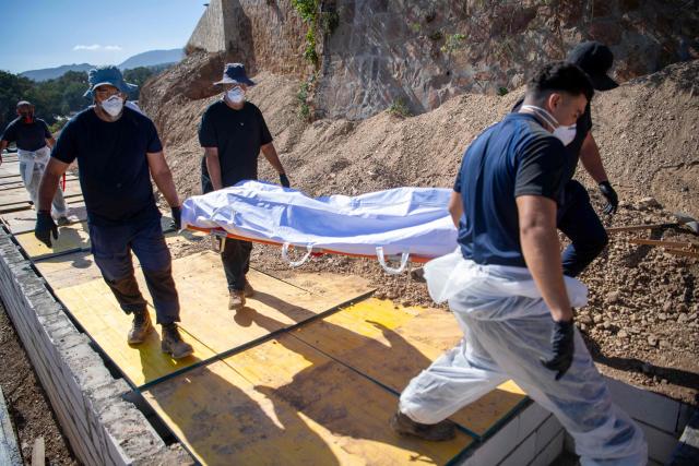 An unidentified migrant who drowned while trying to swim to the Spanish coast of Ceuta from the Moroccan coast is buried in Ceuta, on August 22, 2026. Some 72,000 migrants breached the border in an unprecedented and deadly rush into the north African territory on July 30-31, with 70,000 having since returned to Morocco, according to Spanish government figures. (Photo by Antonio Sempere / AFP)