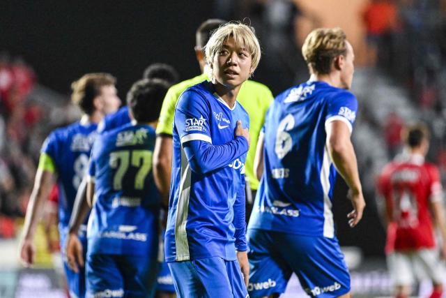 Genk's Japanese forward Ayumu Yokoyama celebrates with teammates after scoring a goal during the Belgian "Pro League" First Division football match between Royal Antwerp FC and KRC Genk at the Bosuilstadion stadium, in Antwerp on August 22, 2026. (Photo by Tom GOYVAERTS / Belga / AFP) / Belgium OUT